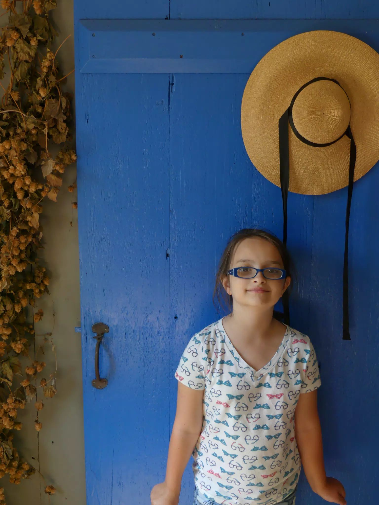 Luciana by the Blue Door of the Pennsylvania Dutch House at the Genesee Country Village Museum