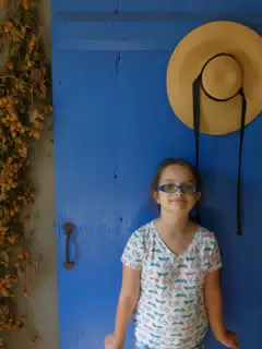 Luciana by the Blue Door of the Pennsylvania Dutch House at the Genesee Country Village Museum