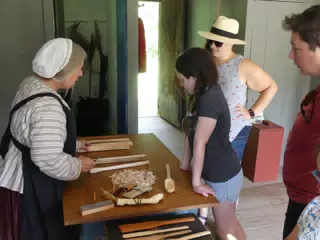 Liesl Learning About Whiddling at the Pennsylvania Dutch House at the Genesee Country Village Museum