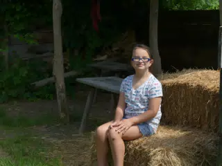 Luciana Sitting on Hay at the Genesee Country Village Museum