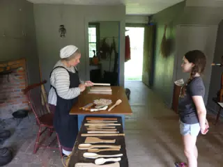 Liesl Learning About Whittling at the Genesee Country Village Museum