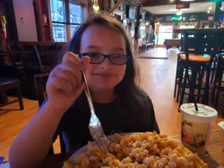 Luciana with Mooney's Famous Mac and Cheese