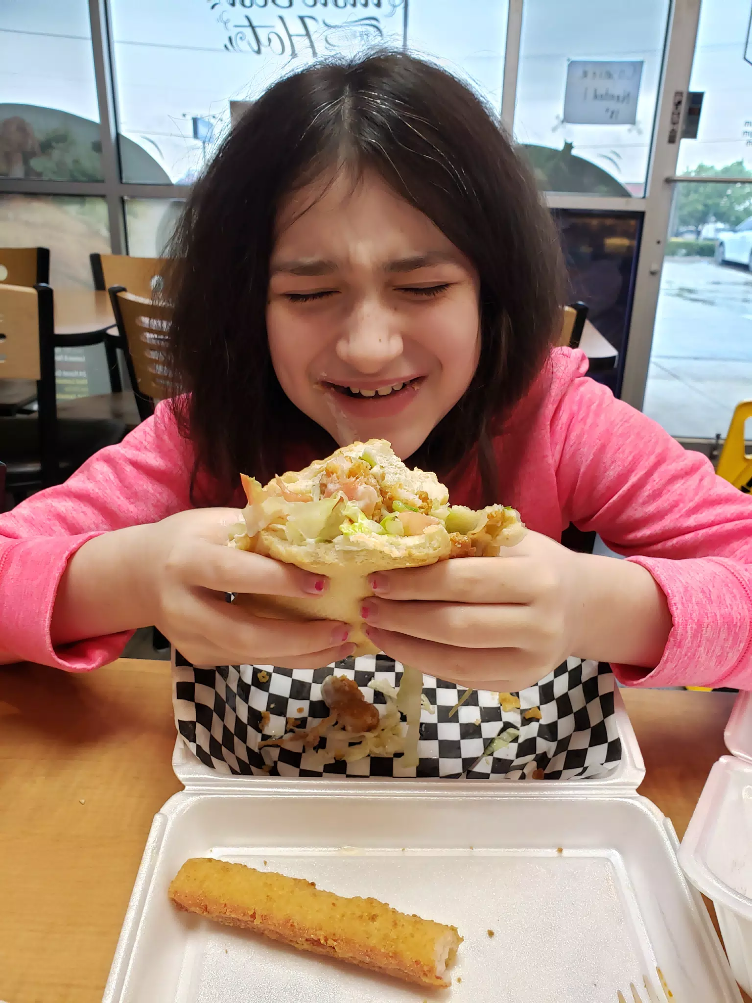 Liesl Eating Shrimp Po Boy