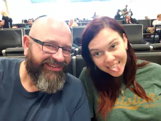 Scott and Rachel waiting at DFW for Our Flight