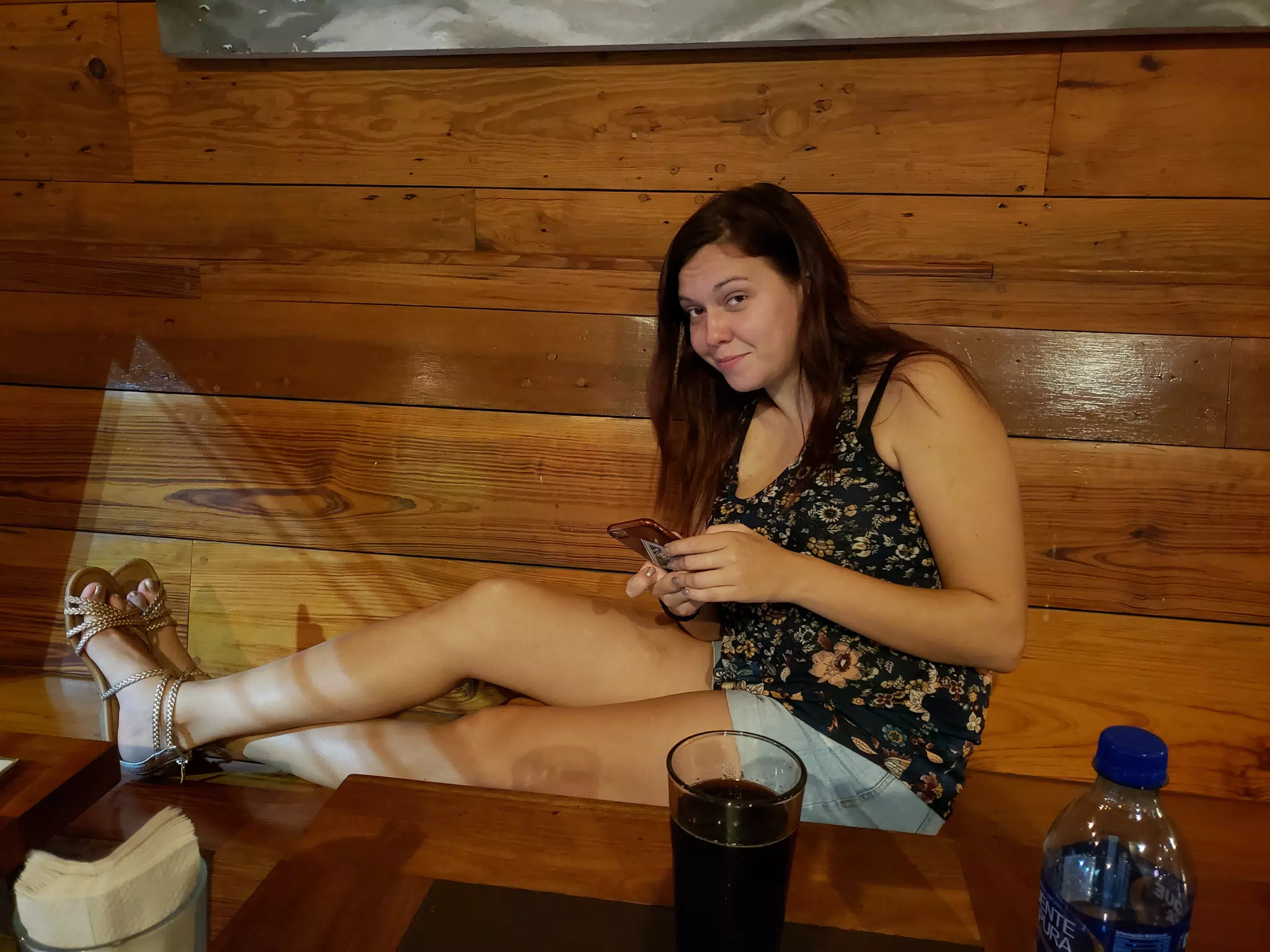 Rachel Glued to Her Phone at the Nicaragua Craft Beer Company