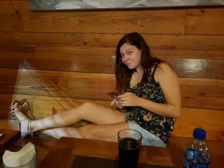 Rachel Glued to Her Phone at the Nicaragua Craft Beer Company