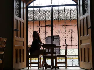 Rachel in Window of El Almirante in Granada