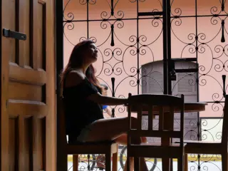 Rachel in Window of El Almirante in Granada