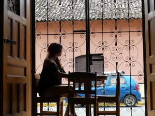 Rachel in Window of El Almirante in Granada