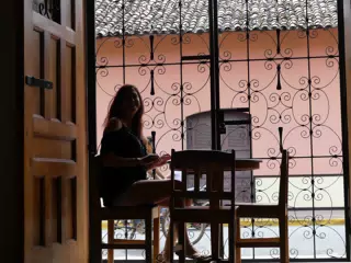 Rachel in Window of El Almirante in Granada