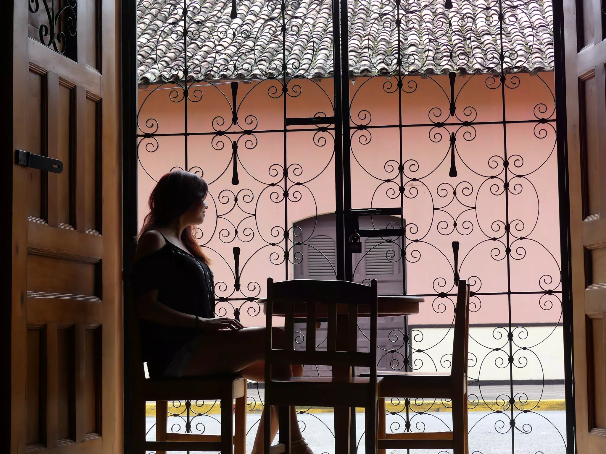 Rachel in Window of El Almirante in Granada