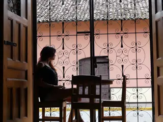 Rachel in Window of El Almirante in Granada