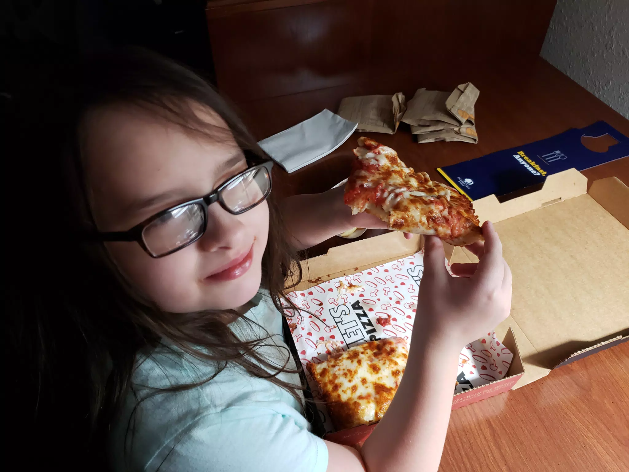 Luciana Eating Jet's Pizza at the DoubleTree