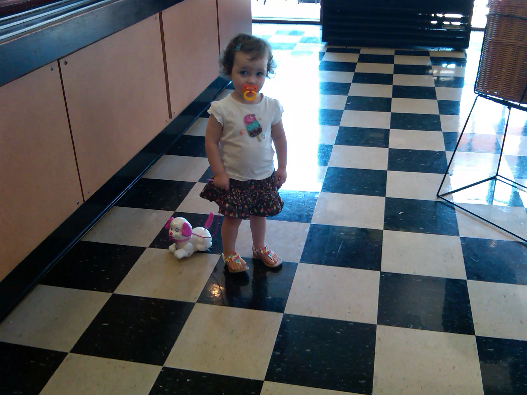 Liesl at the Bagel Shop with Her Puppy