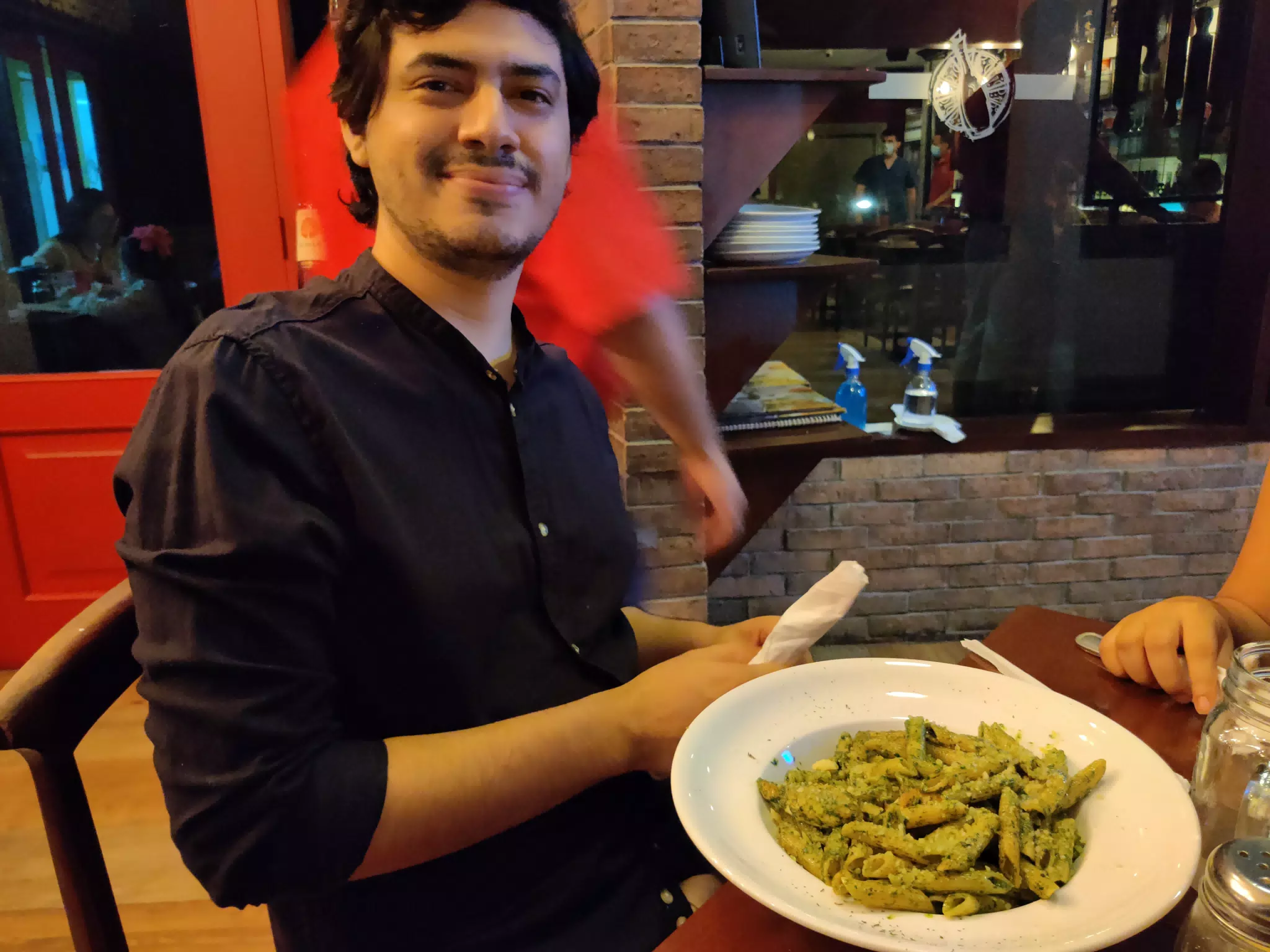 Luis with Penne Pesta at Pane e Vino in Managua
