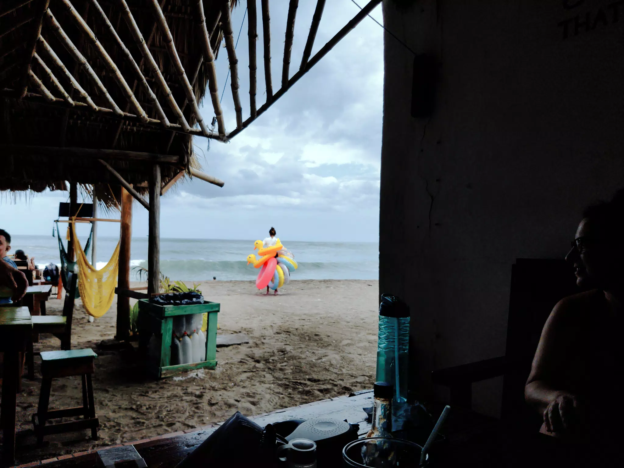 Woman Selling Floats and Rubber Ducks on Beach