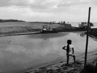 Girl Watching the Opening of the San Juan Venado Estuary in Las Peñitas Nicaragua