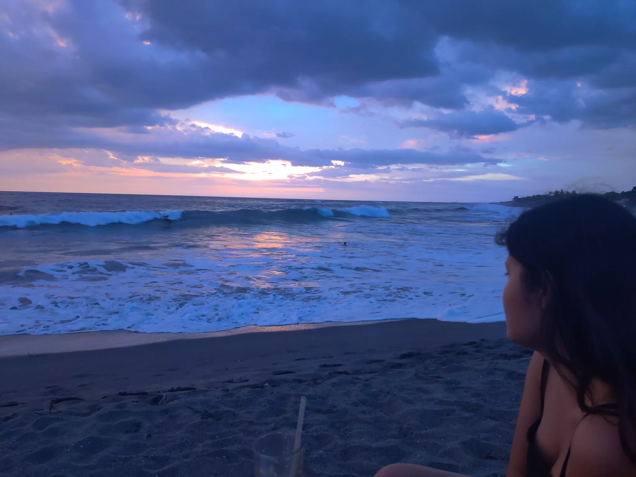 Anahi Watching the Sunset Over the Ocean