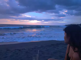Anahi Watching the Sunset Over the Ocean