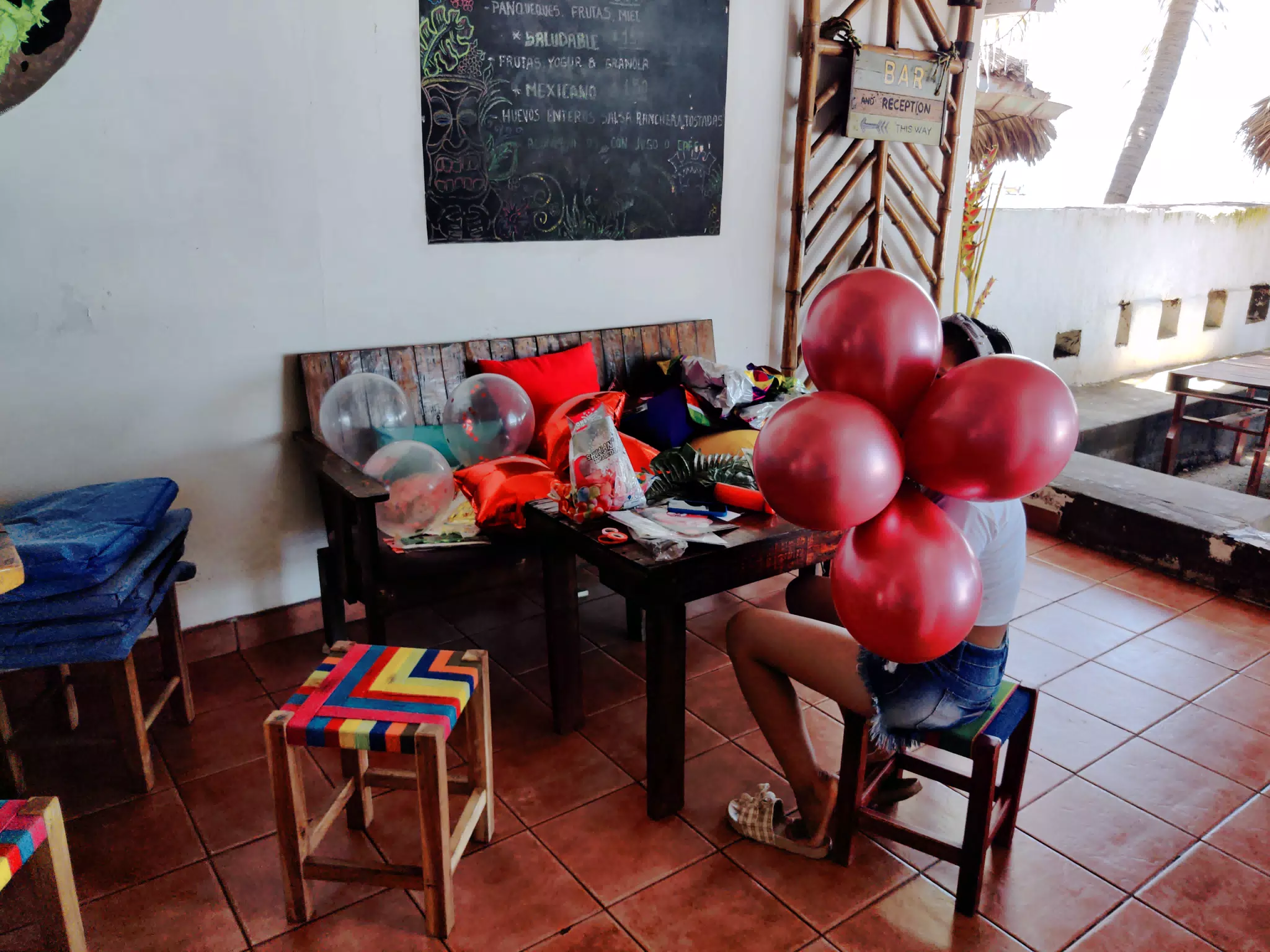 Ingrid Hiding Behind Balloons