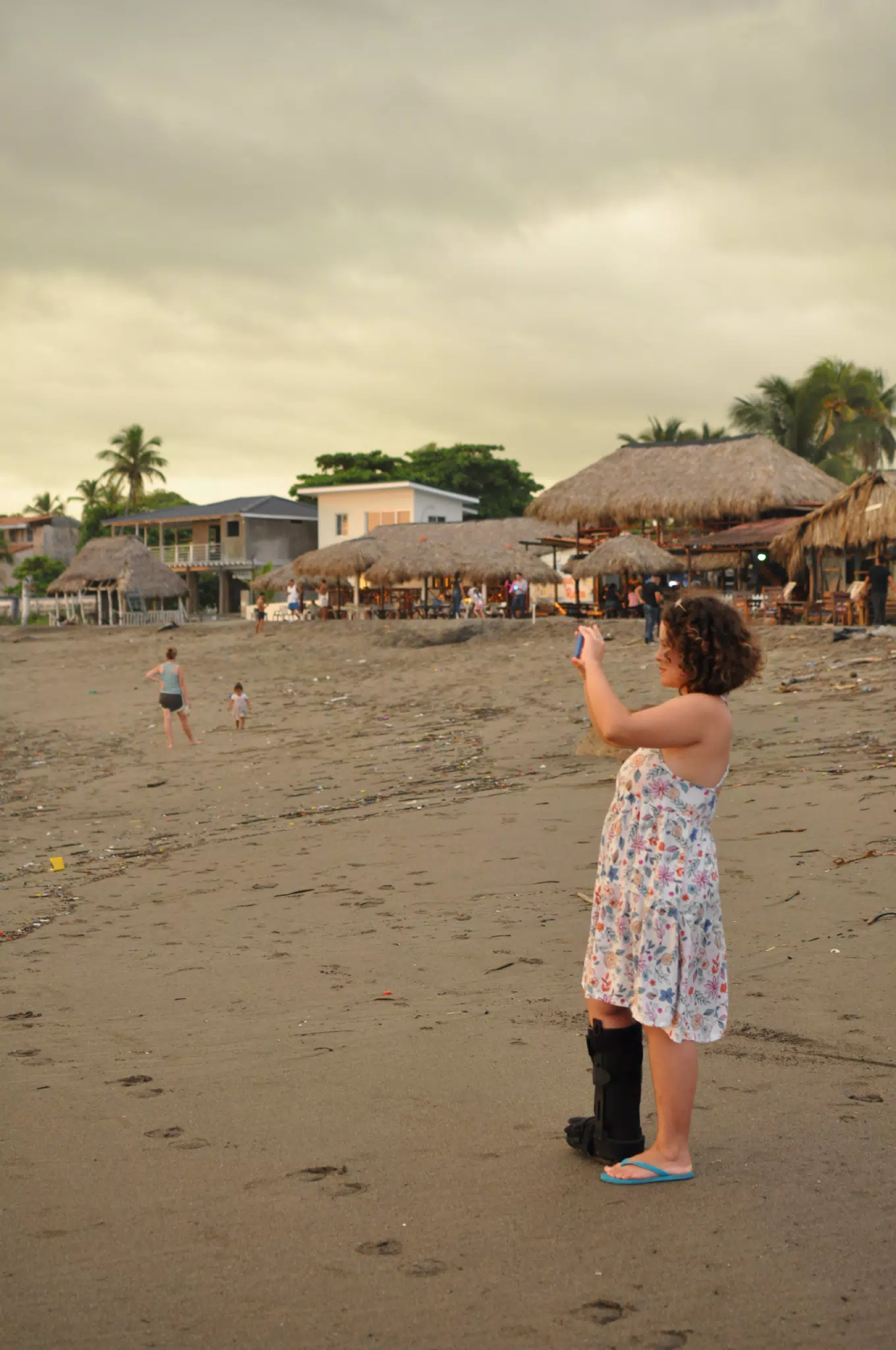 Ivonne with Foot in Cast Taking Pictures of the Sunset