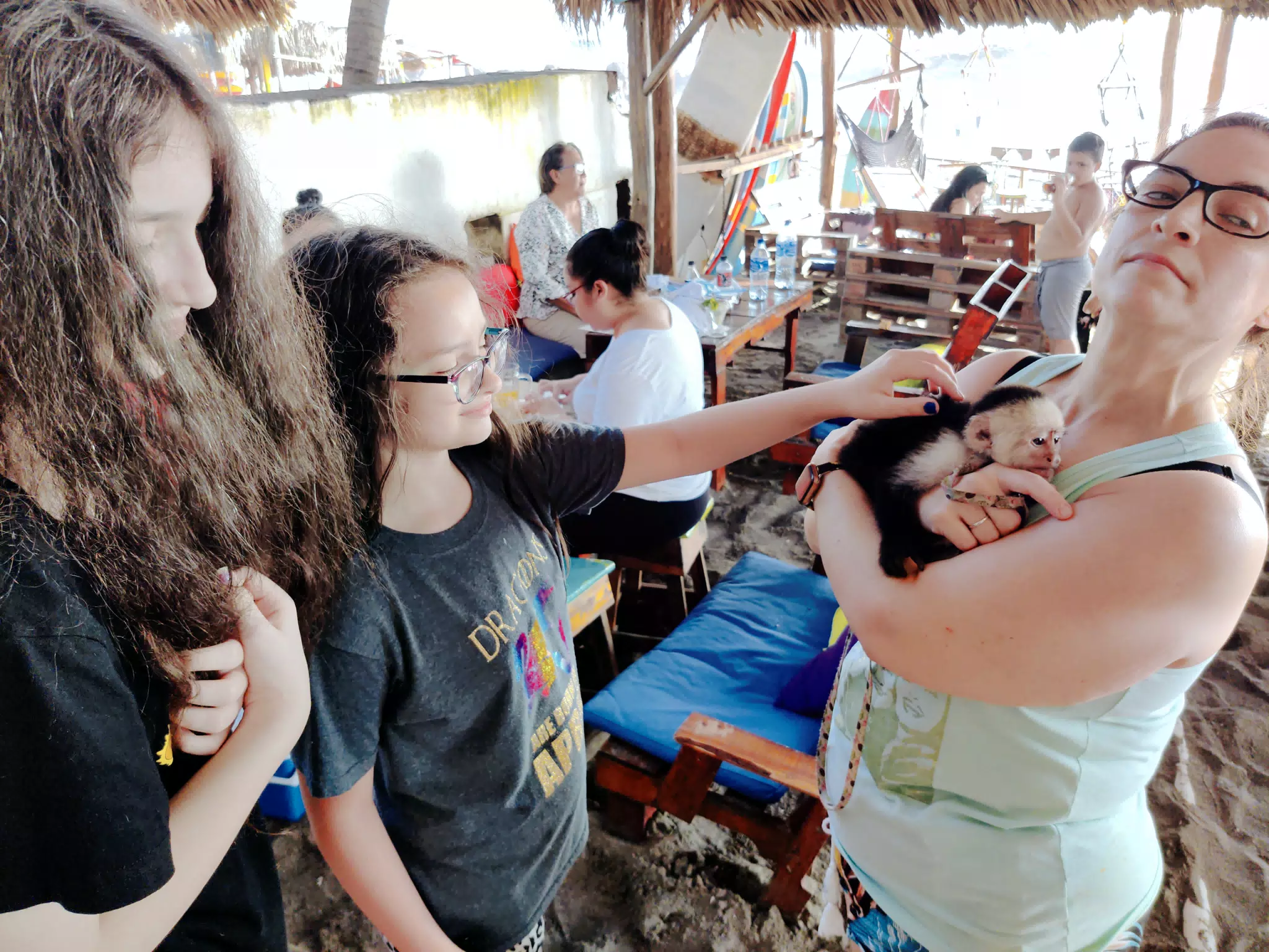 Ciana Petting the Monkey in the Restaurant