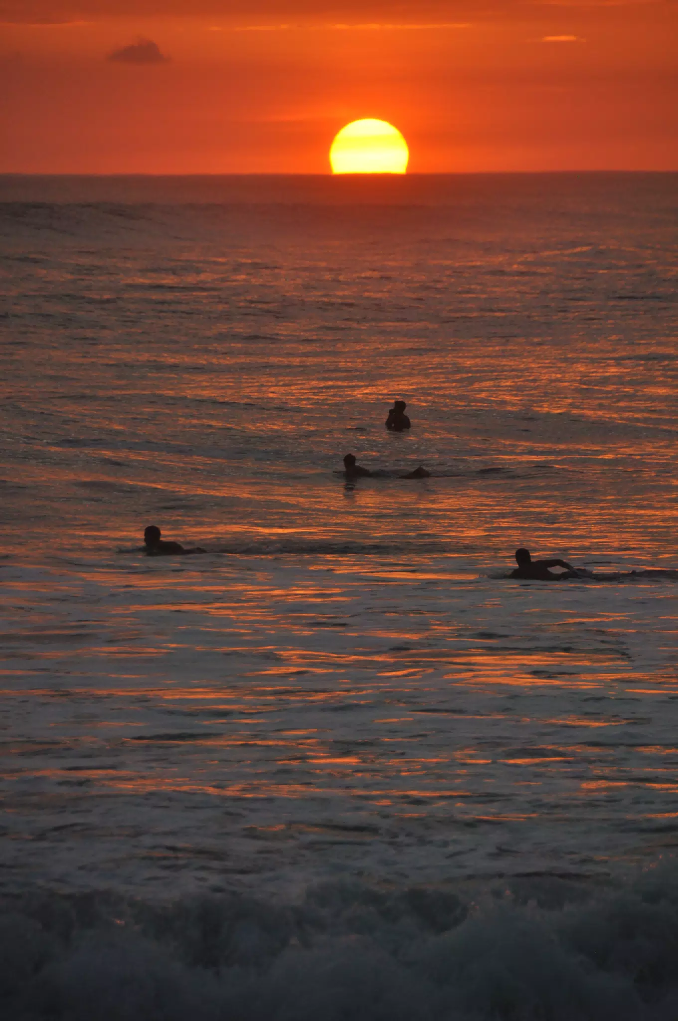 Swimmers in the Pacific Ocean at Sunset in Las Peñitas