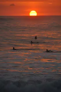 Swimmers in the Pacific Ocean at Sunset in Las Peñitas