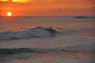 Surfers in Las Penitas Sunset on the Pacific Ocean