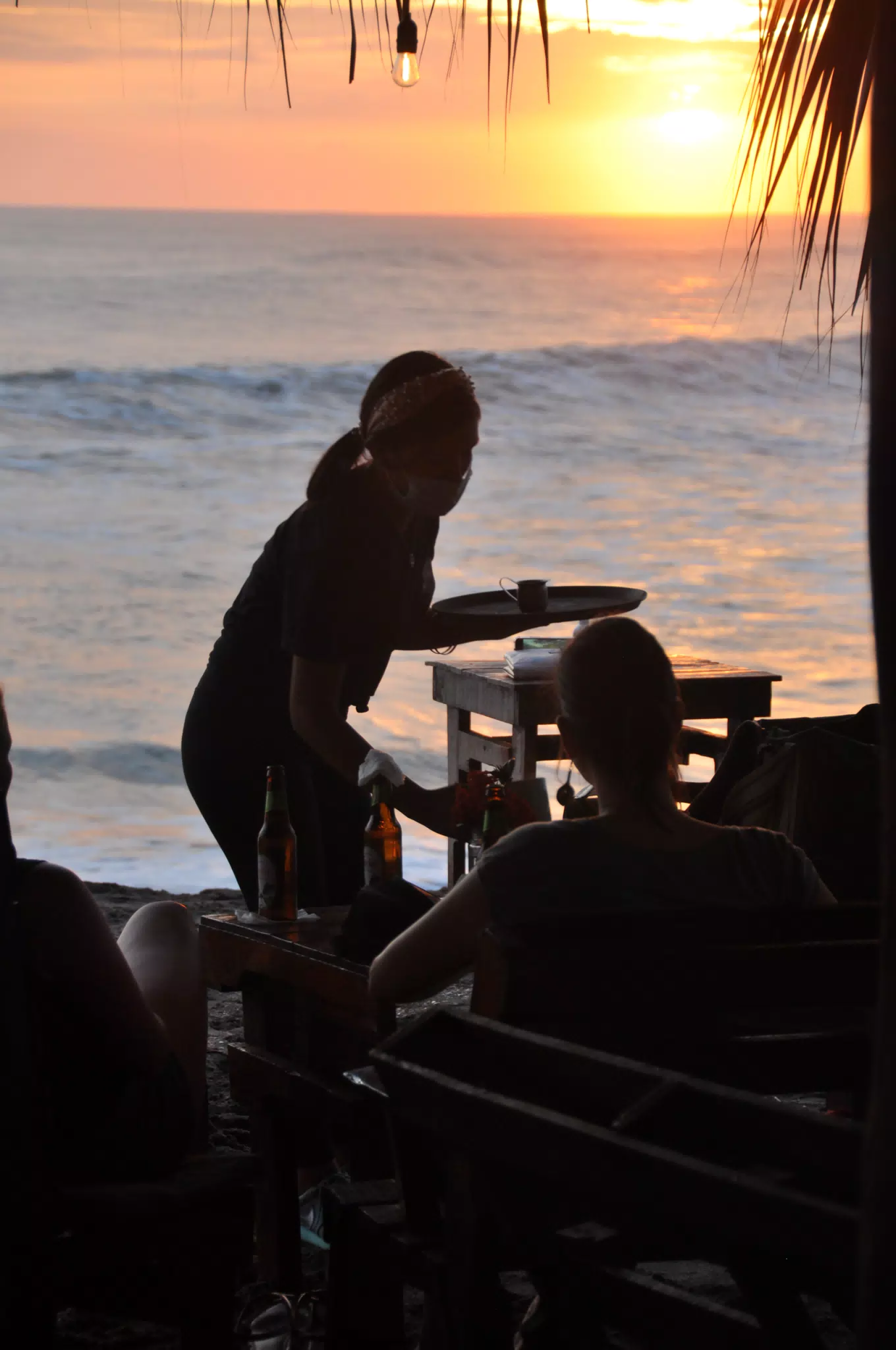 Waitress Silouhette in Sunset on Pacific Beach