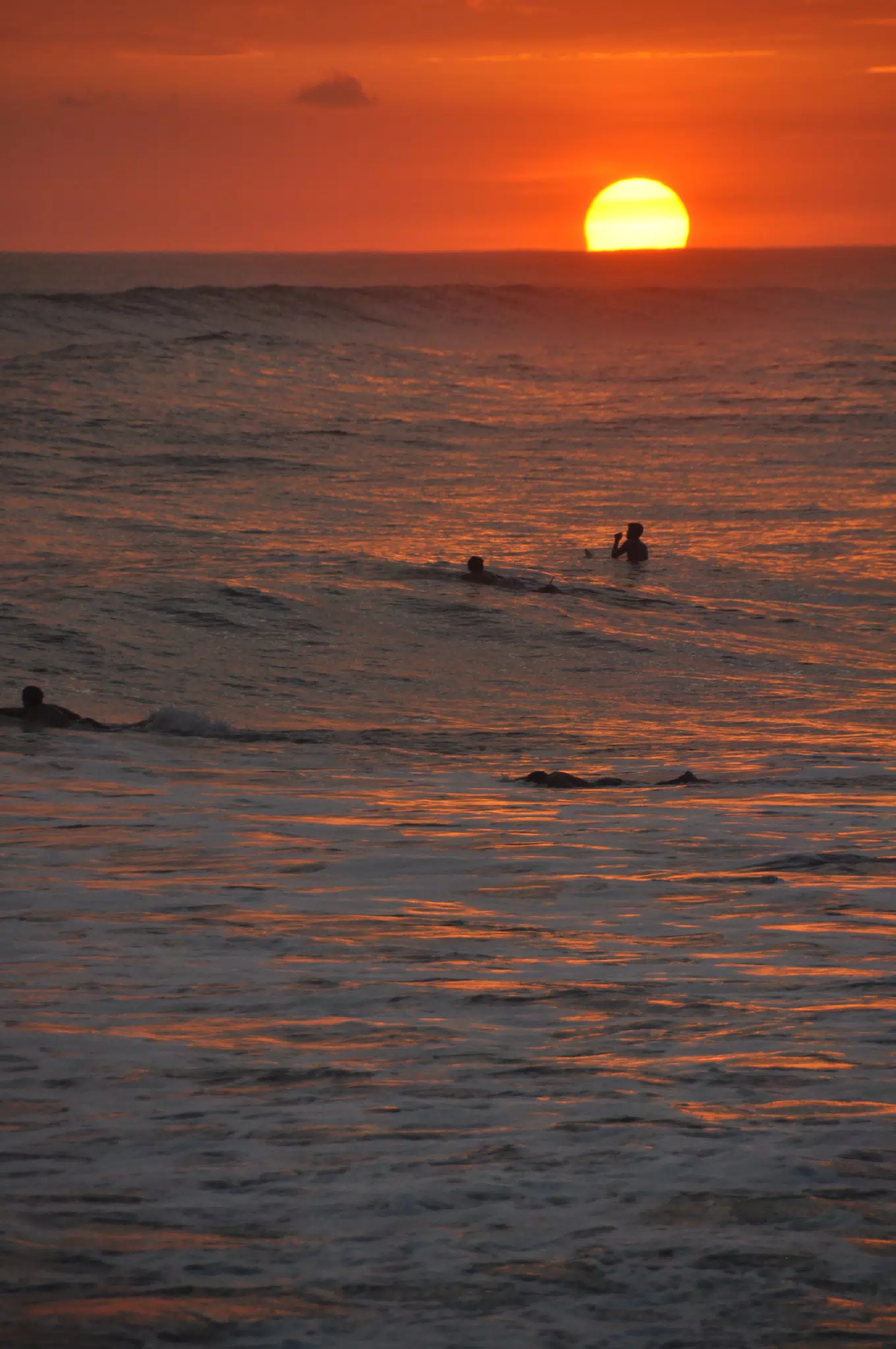 Swimmers in Pacific Sunset