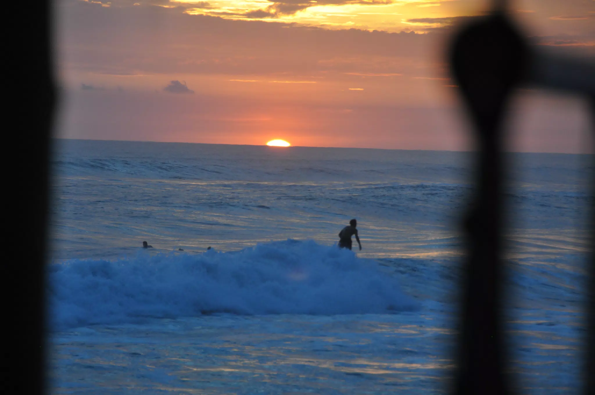 Surfers in Pacific from Hotel