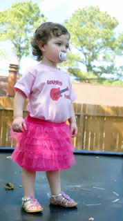 Liesl on Trampoline with Glitter and Pacifier