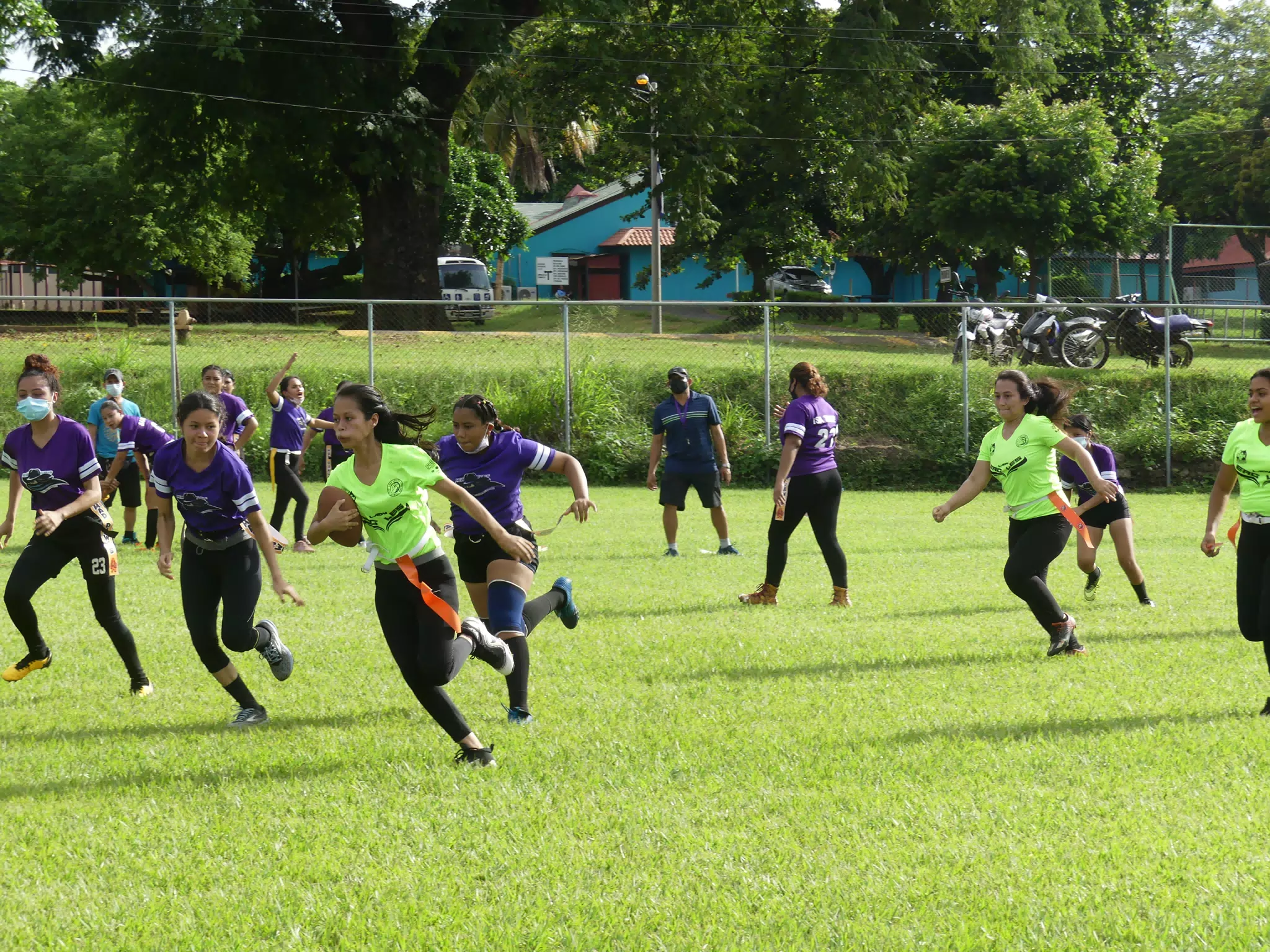 Mileydi Garcia with Football - Managua Lady Eagles American Flag Football