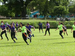Mileydi Garcia with Football - Managua Lady Eagles American Flag Football
