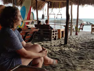Ivonne Watching the Sunset at the Simple Beach Lodge