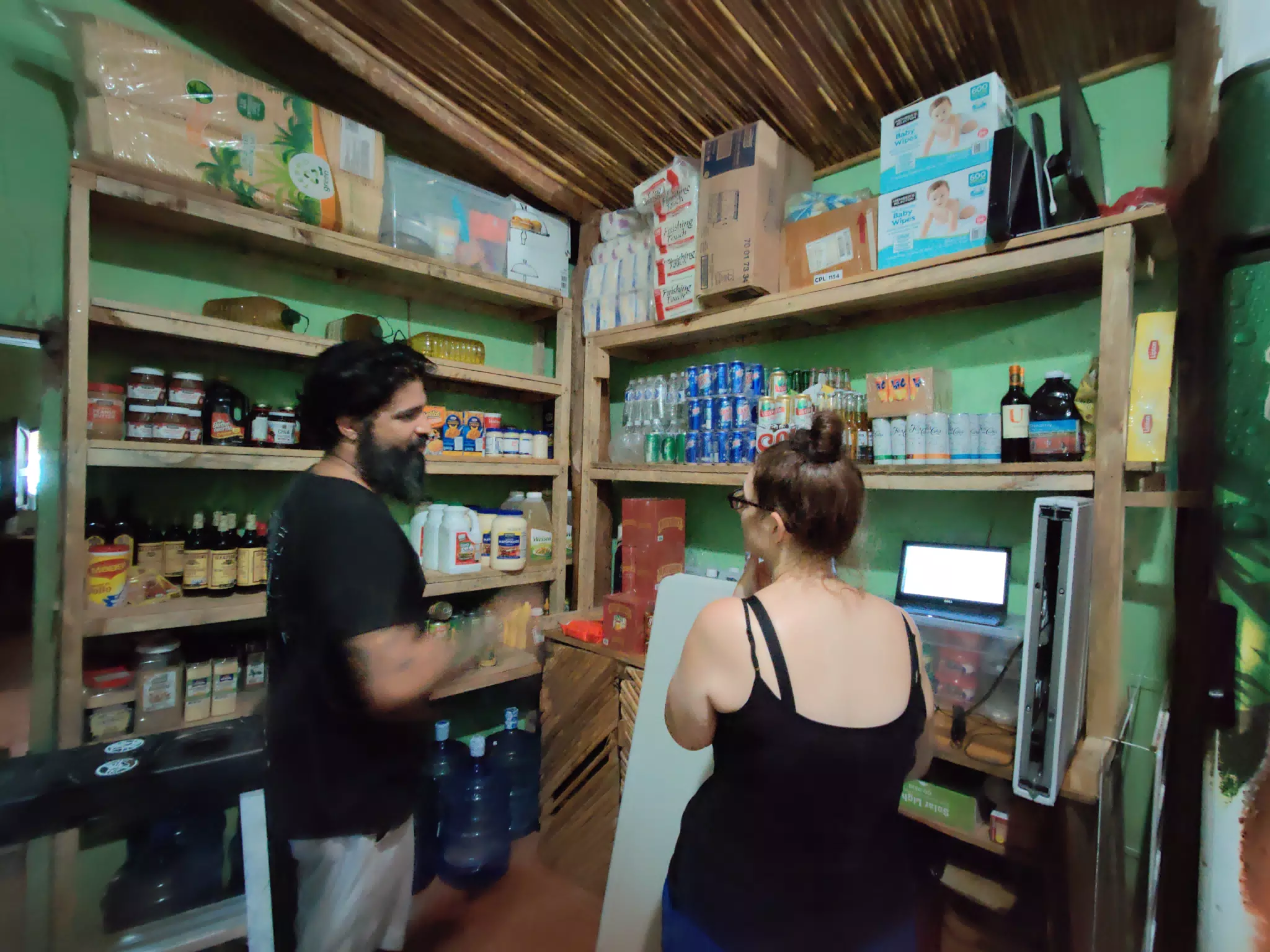 Saeed and Dominica Working Inventory in the Bodega