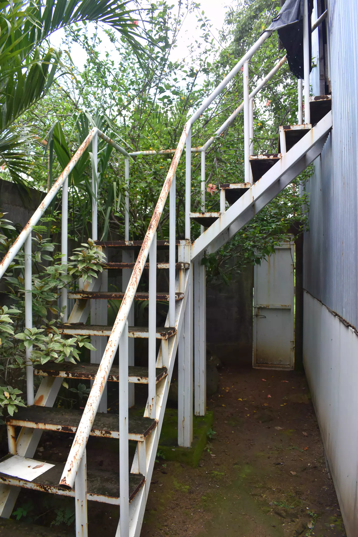 SG: Stairs to Second Floor at Front Against Road