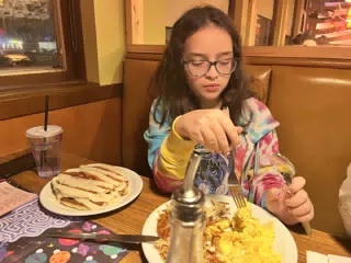 Luciana Eating at Denny's in Geneseo
