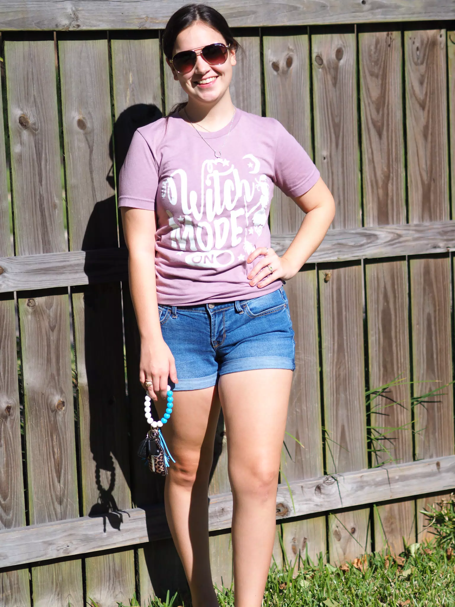 Emily Posing by Fence with Keys