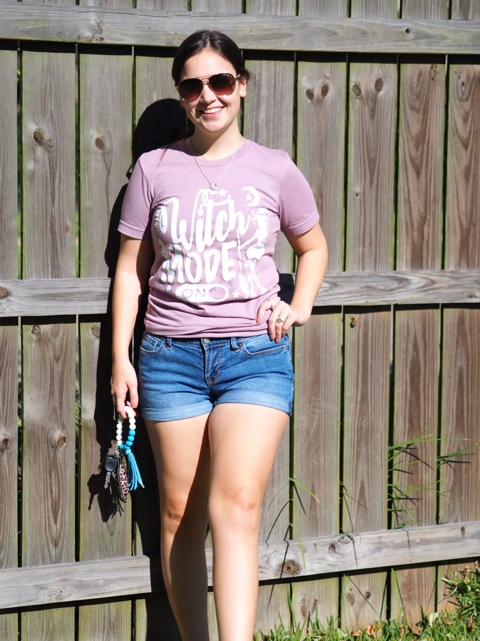 Emily Posing by Backyard Fence