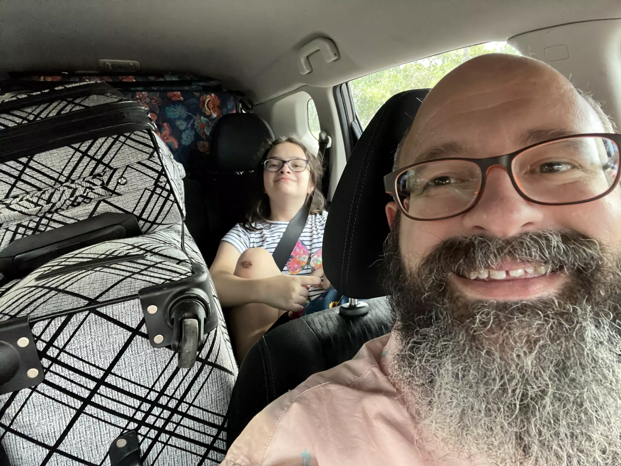Luciana in Back Seat with Luggage Pile En Route to Houston Airport