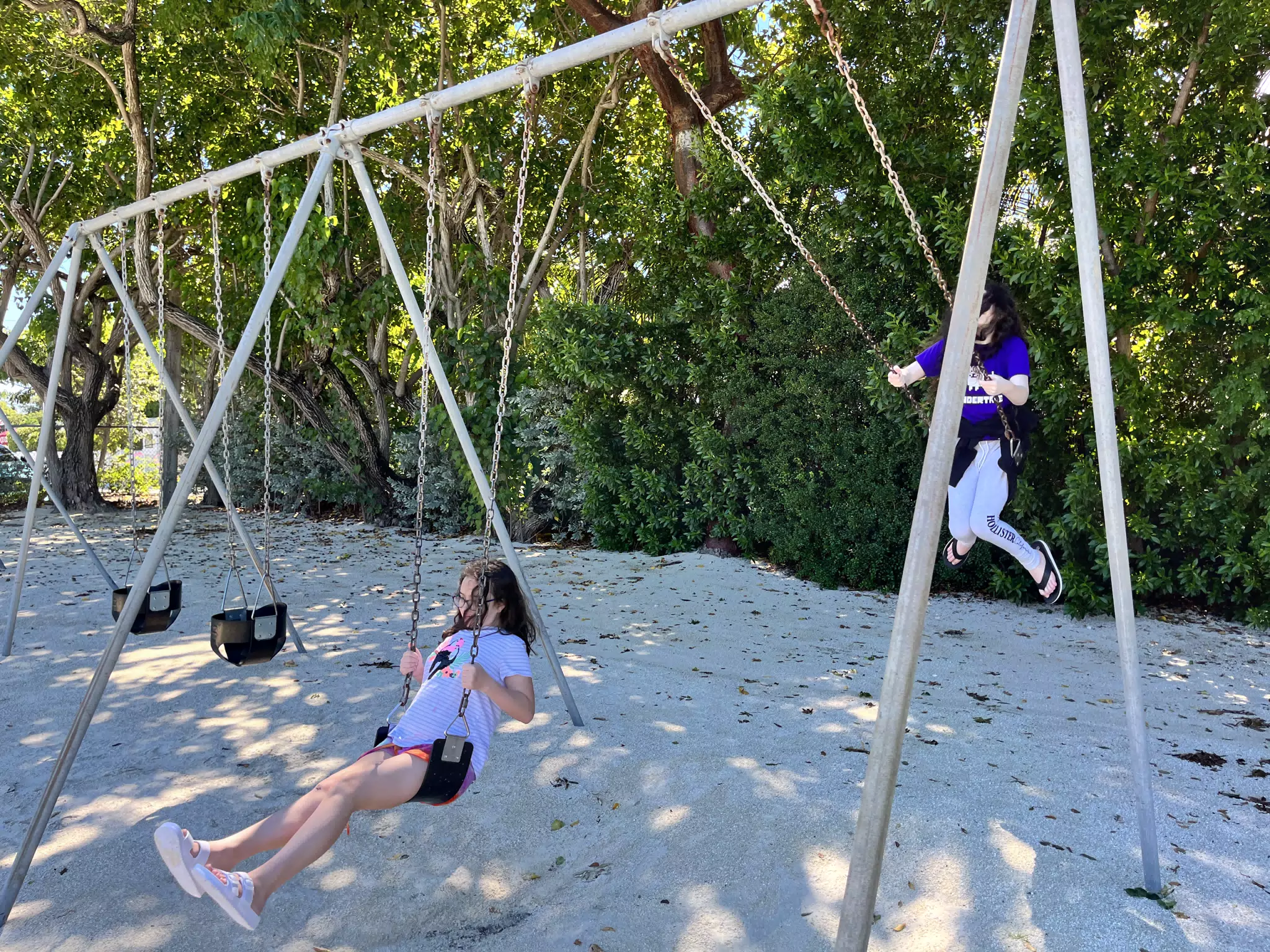 The Girls on the Swings at Library Beach