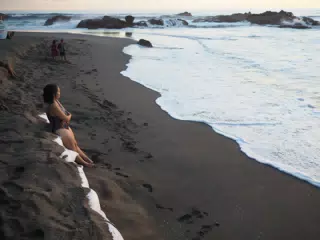 Ivonne on Sand Bags on Eroded Beach at Las Penitas