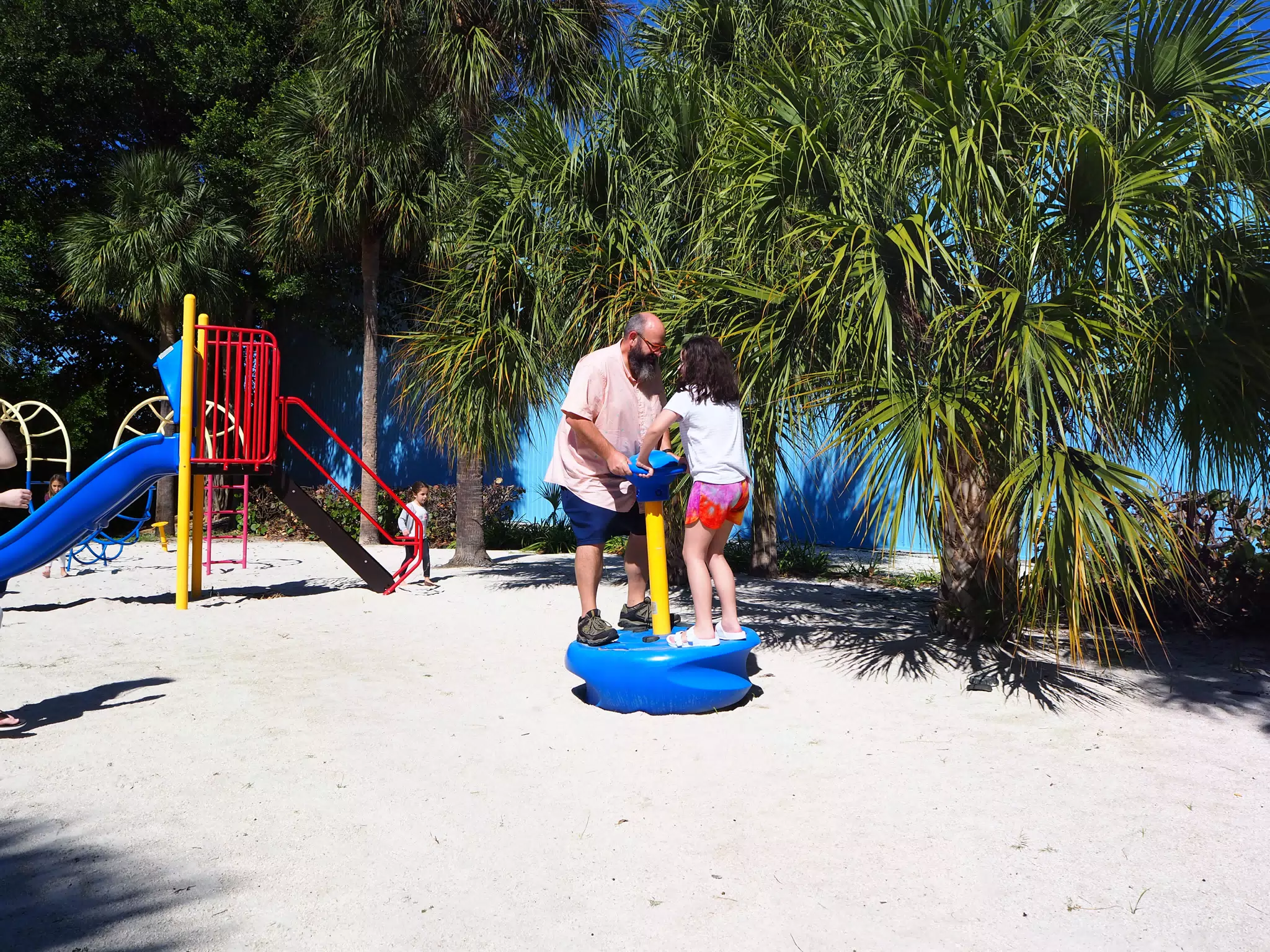 Ciana and Dad on Playground at Library Beach