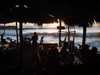 Diners at Sunset at the Simple Beach Lodge in Las Penitas Nicaragua
