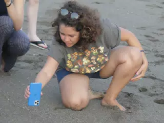 Ivonne Filming with iPhone on Beach