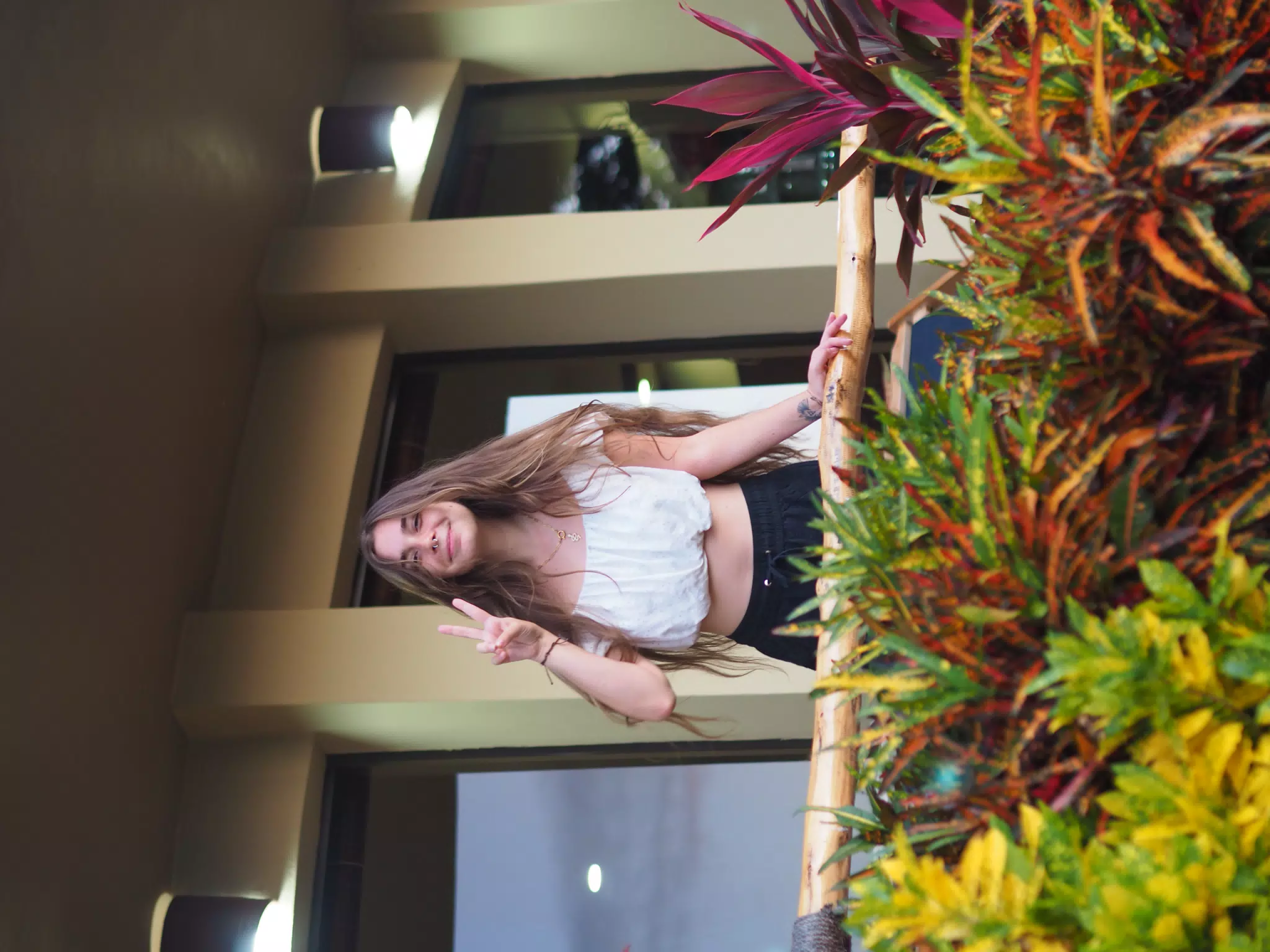 Camille Peace Sign on Balcony
