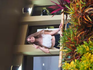 Camille Peace Sign on Balcony