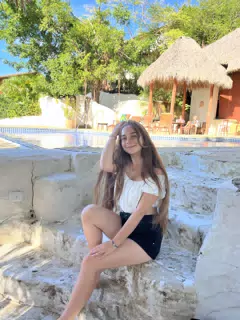 Camille Sitting on the Poolside Steps at La Cascada at Pelican Eyes in San Juan del Sur, Nicaragua